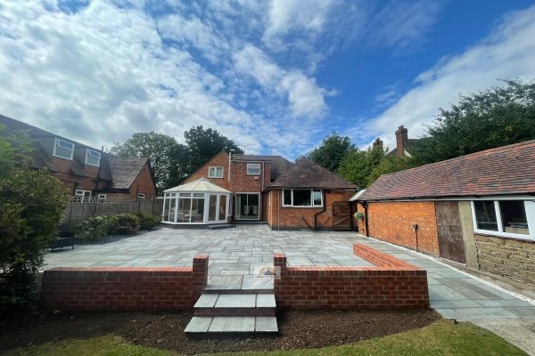 Sandstone Slabbed Patio With Brick Retaining Wall And Steps In Hillmorton, Rugby (5)